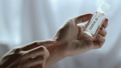 Aromatherapy essential oil being applied to wrist