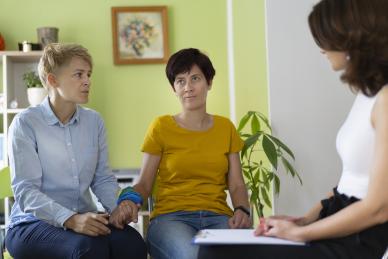 Image of female partners attending an appointment with a health professional