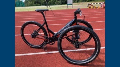 Triple Tread trike showing two front wheels and one back wheel