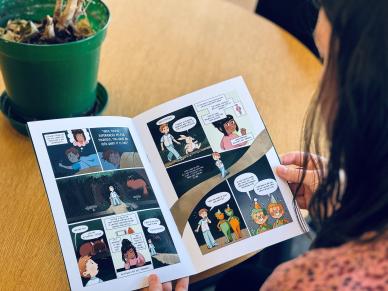 Person reading MS health information comic