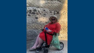 Antoinette on holiday in a powered wheelchair