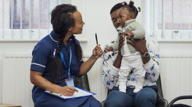 Nurse with a father and daughter