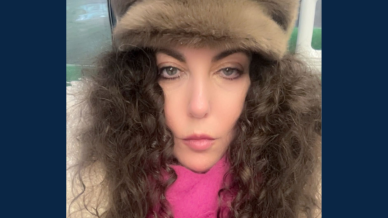 lady with long brown curly hair