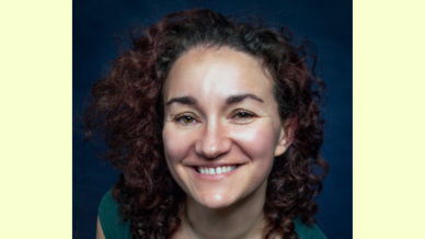lady with long brown curly hair