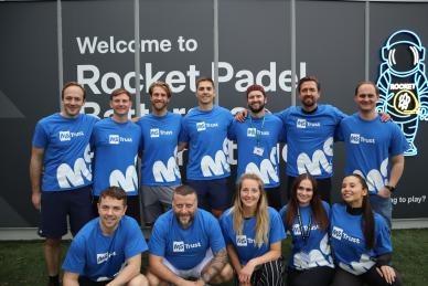 A group of people in MS Trust brand t-shirts