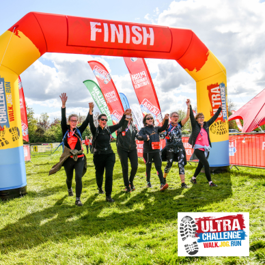 A group of people crossing the finish line at an Ultra Challenge