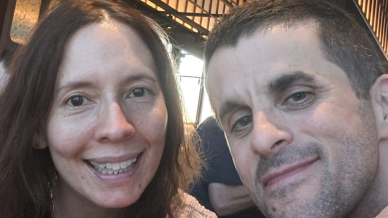 lady with brown hair and man with brown hair smiling