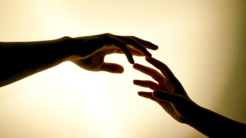 Hands touching
