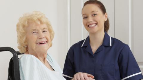 Lady in wheelchair with nurse