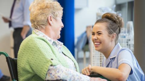 Nurse laughing with patient