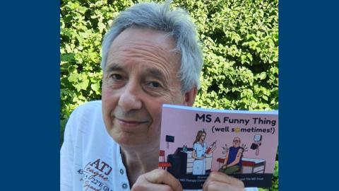 Nigel holding his book MS a Funny Thing