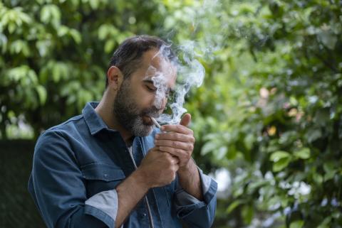 man smoking cigarette