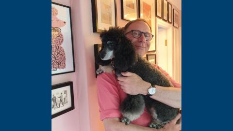 Chris holding his dog