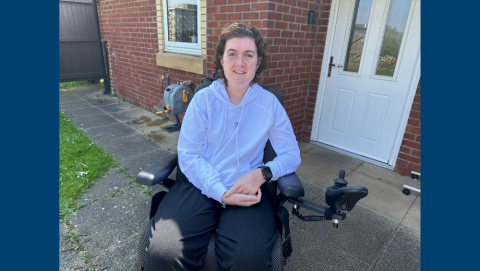 Jasmine in a powered wheelchair