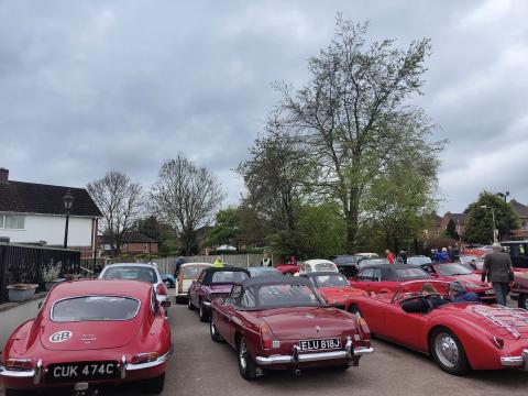 car park full of red classic cars