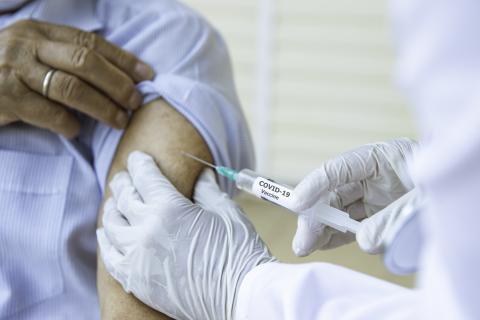 Covid-19 vaccine being injected into arm