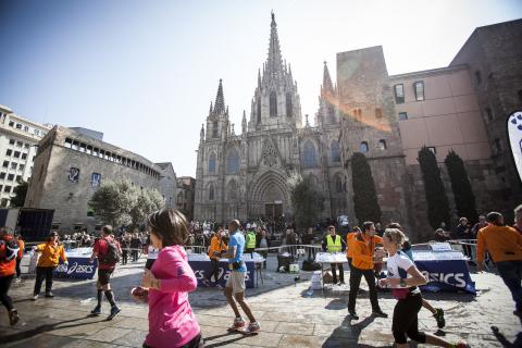runners in front of Sagrada Familia in Barcelona, Spain
