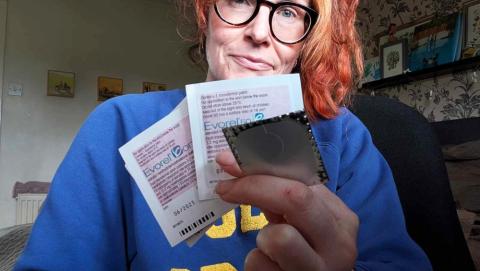 Helena holding up HRT patches