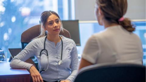 doctor listening intently to a patient during a medical appointment 