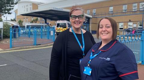 Ashley and Carmel, MS Nurses. Standing in front of Sunderland Royal Hospital.