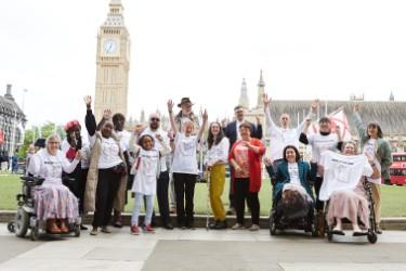 Group of people supporting the #Backthe1in6 campaign outside Pariliament