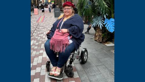 Antoinette in a powered wheelchair