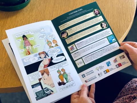Person reading MS health information comic