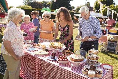 Busy cake stall at a summer garden fete