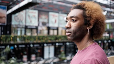 Person sitting on a bench looking away