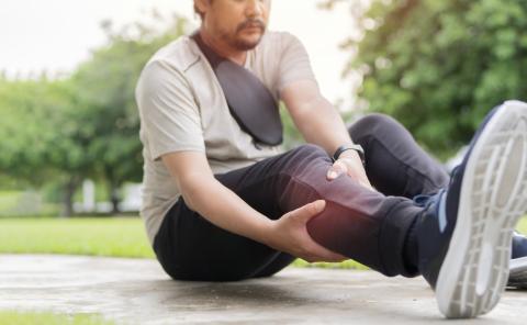 Man with a spasm in his leg