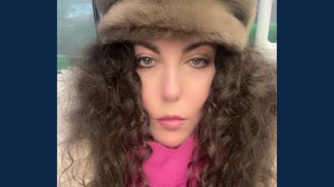 lady with long brown curly hair