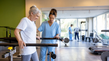 A woman with MS with a physio
