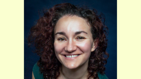 lady with long brown curly hair