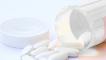 A bottle of white pills